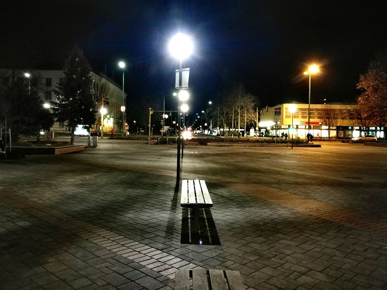 ILLUMINATED STREET LIGHTS AT NIGHT