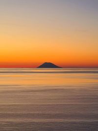 Scenic view of sea against clear sky during sunset