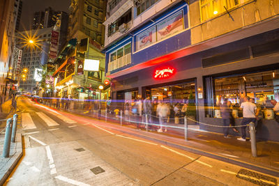 Illuminated city street at night