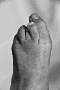 Close-up of human hand on sand