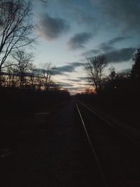 View of railroad tracks against sky during sunset