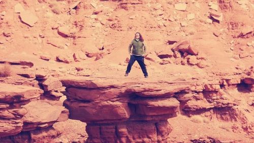 Woman standing on rock formation