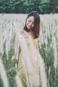 Portrait of woman on field