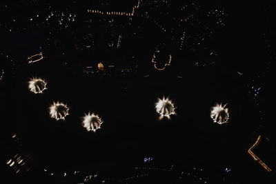 Low angle view of firework display at night