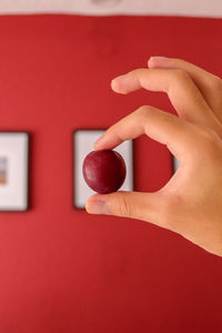 Close-up of woman hand holding strawberry