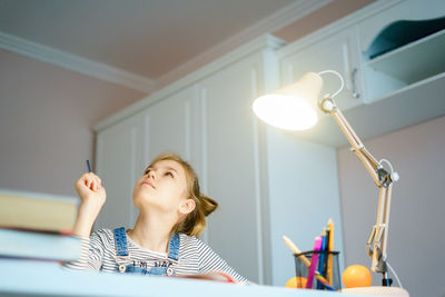 Portrait of girl studying at home