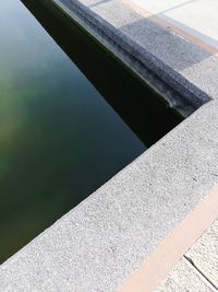 High angle view of wall by lake