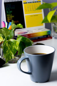 Close-up of coffee cup on table