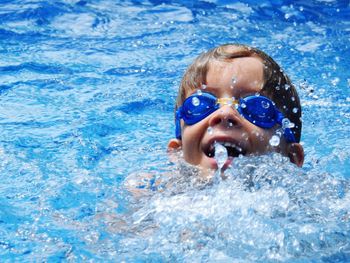 Woman swimming in swimming pool