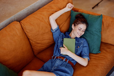 Portrait of boy sleeping on sofa at home