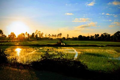 Scenic view of lake against sky during sunset