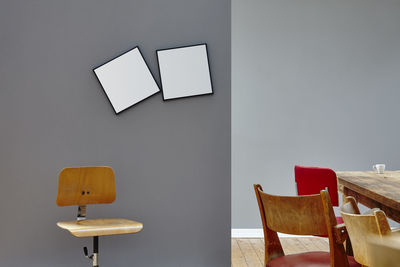 Empty chairs and table against wall at home