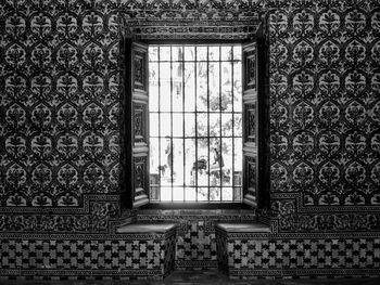 Window of floral patterned wall