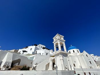 Low angle view of building against clear blue sky