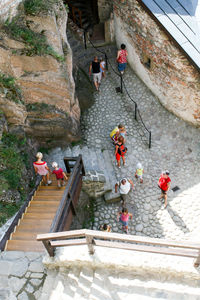 High angle view of people on steps by mountain