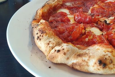 High angle view of pizza in plate on table