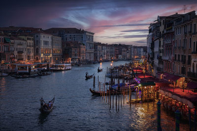 Boats in canal in city