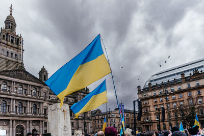 Low angle view of people in city