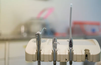 Close-up of clothespins on clothesline