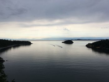 Scenic view of sea against sky at dusk