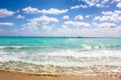 Scenic view of sea against cloudy sky