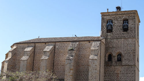 Low angle view of historic building against clear sky