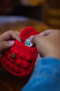 Close-up of woman holding red hands