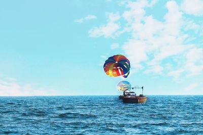 View of boat in sea against sky