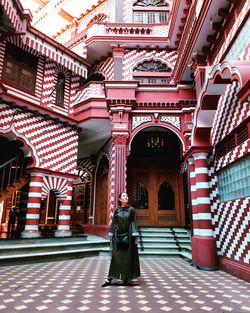 Rear view of woman walking in building