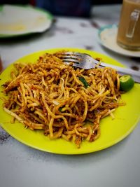 Close-up of noodles served in plate on table