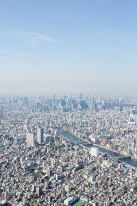 High angle view of city buildings against sky