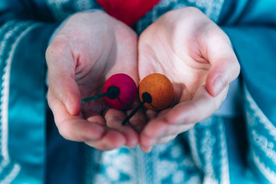 Close-up of woman holding fruits