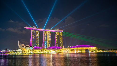 Illuminated ferris wheel at night