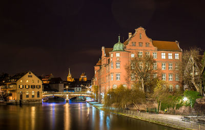 Illuminated buildings in city at night