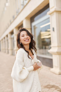 Young woman standing in city