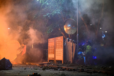 Panoramic view of fire at night