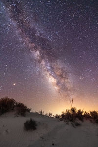 Scenic view of landscape against sky at night
