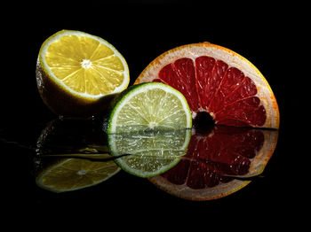 Close-up of lemon slice against black background