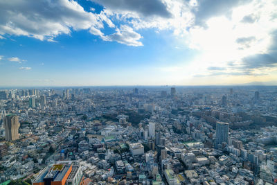 High angle view of city buildings against sky