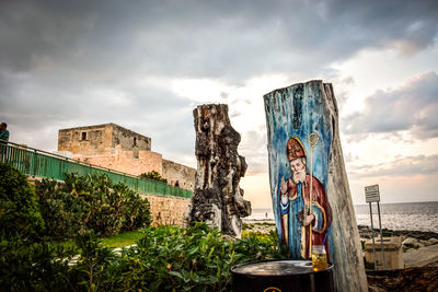 Panoramic view of old building against cloudy sky