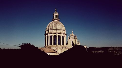 Low angle view of church against blue sky