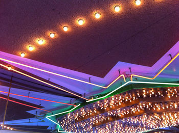 Low angle view of illuminated lights at night