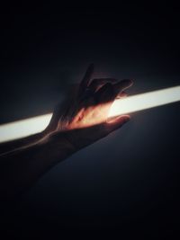 Close-up of sunlight falling on hand
