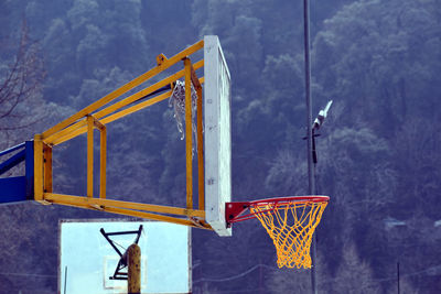 Low angle view of basketball hoop against sky