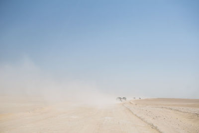 Scenic view of desert against clear sky