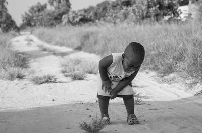 Boy standing on beach