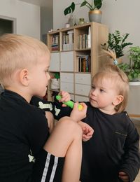 Portrait of cute girl playing with toys at home