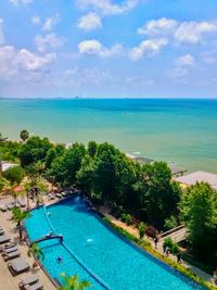 High angle view of swimming pool by sea against sky