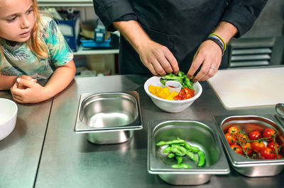 Midsection of woman preparing food on table