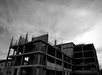 Low angle view of abandoned building against sky